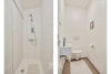 Voorzien van ligbad, douche en dubbele lavabo in badkamermeubel 
